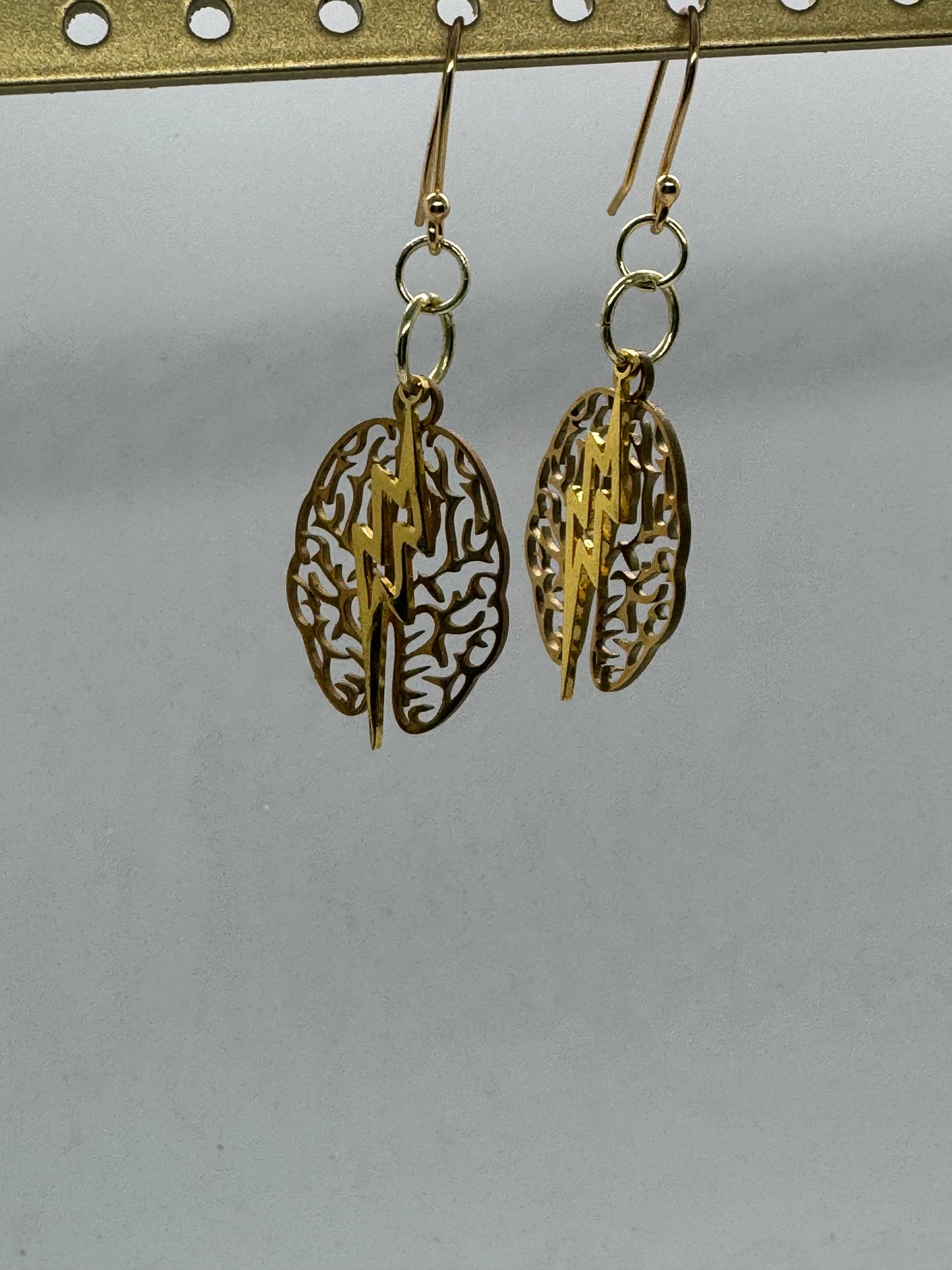 Brain and lightning gold earrings