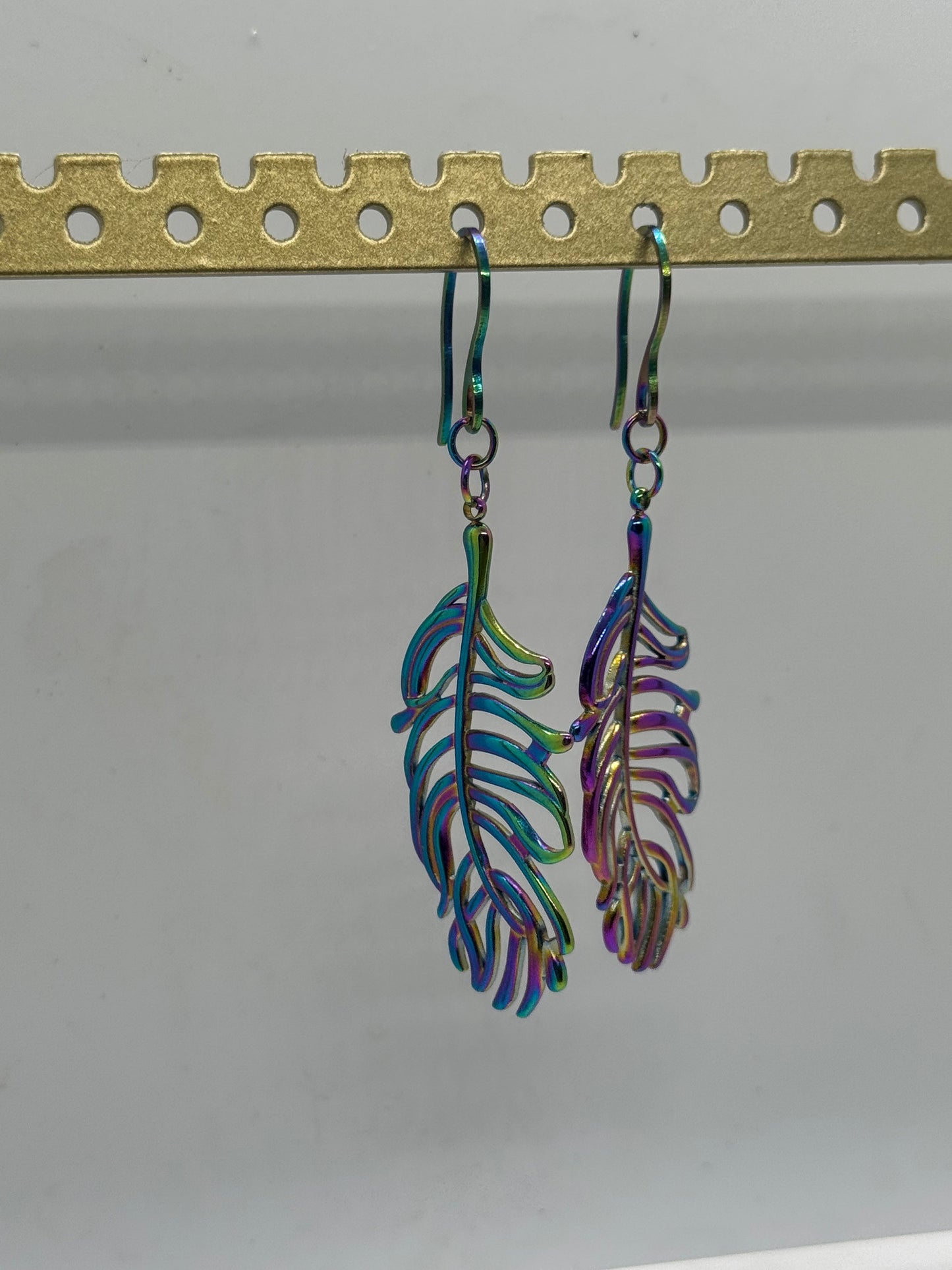 Iridescent purple feather earrings