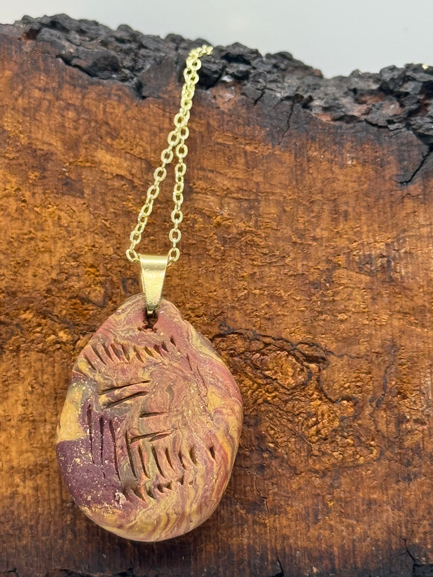 Amber and clay pendant necklace
