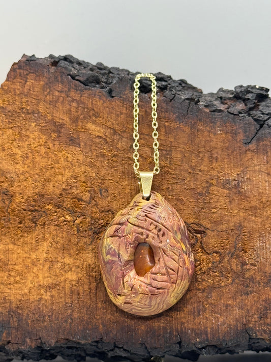 Amber and clay pendant necklace