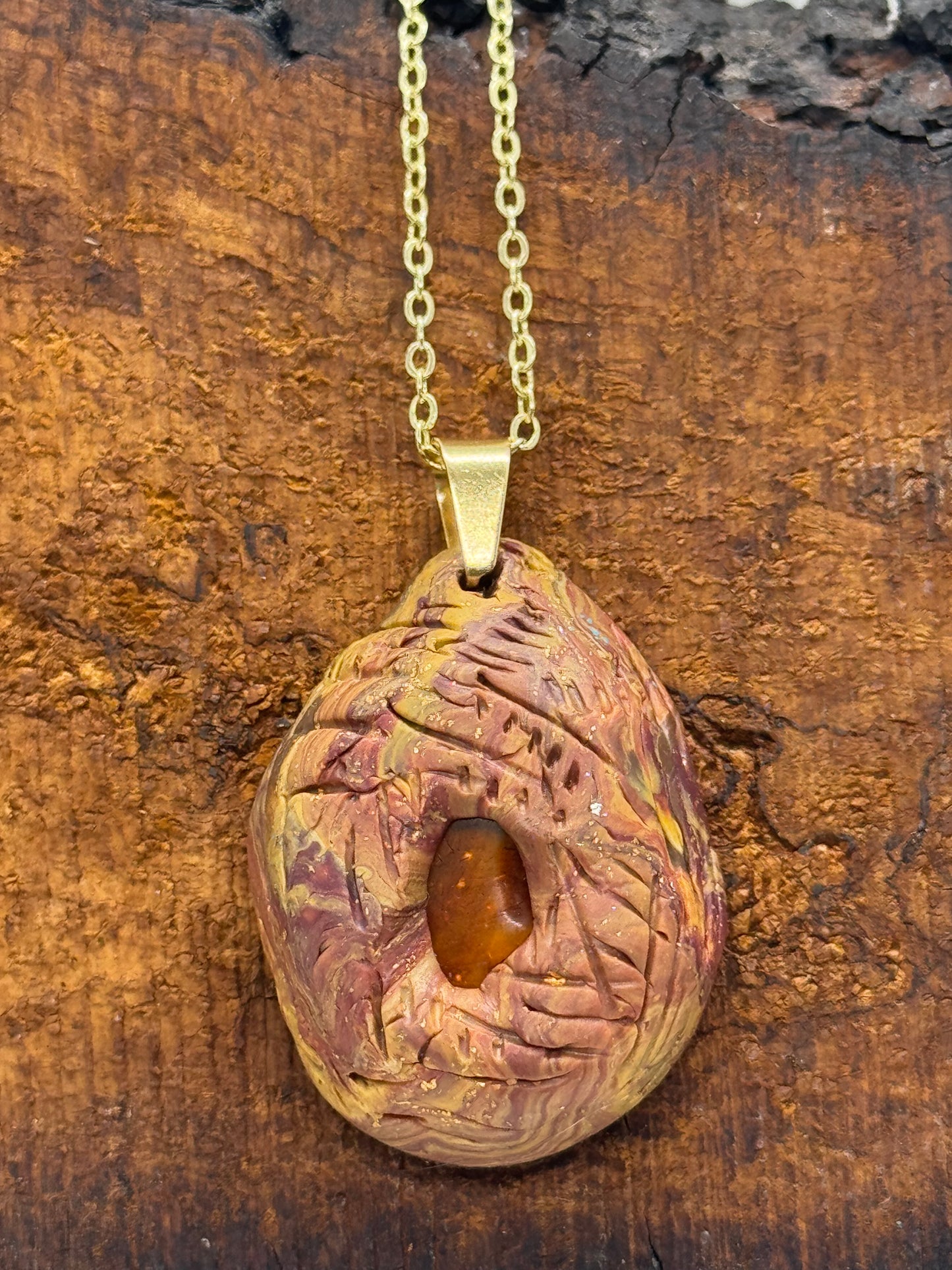 Amber and clay pendant necklace