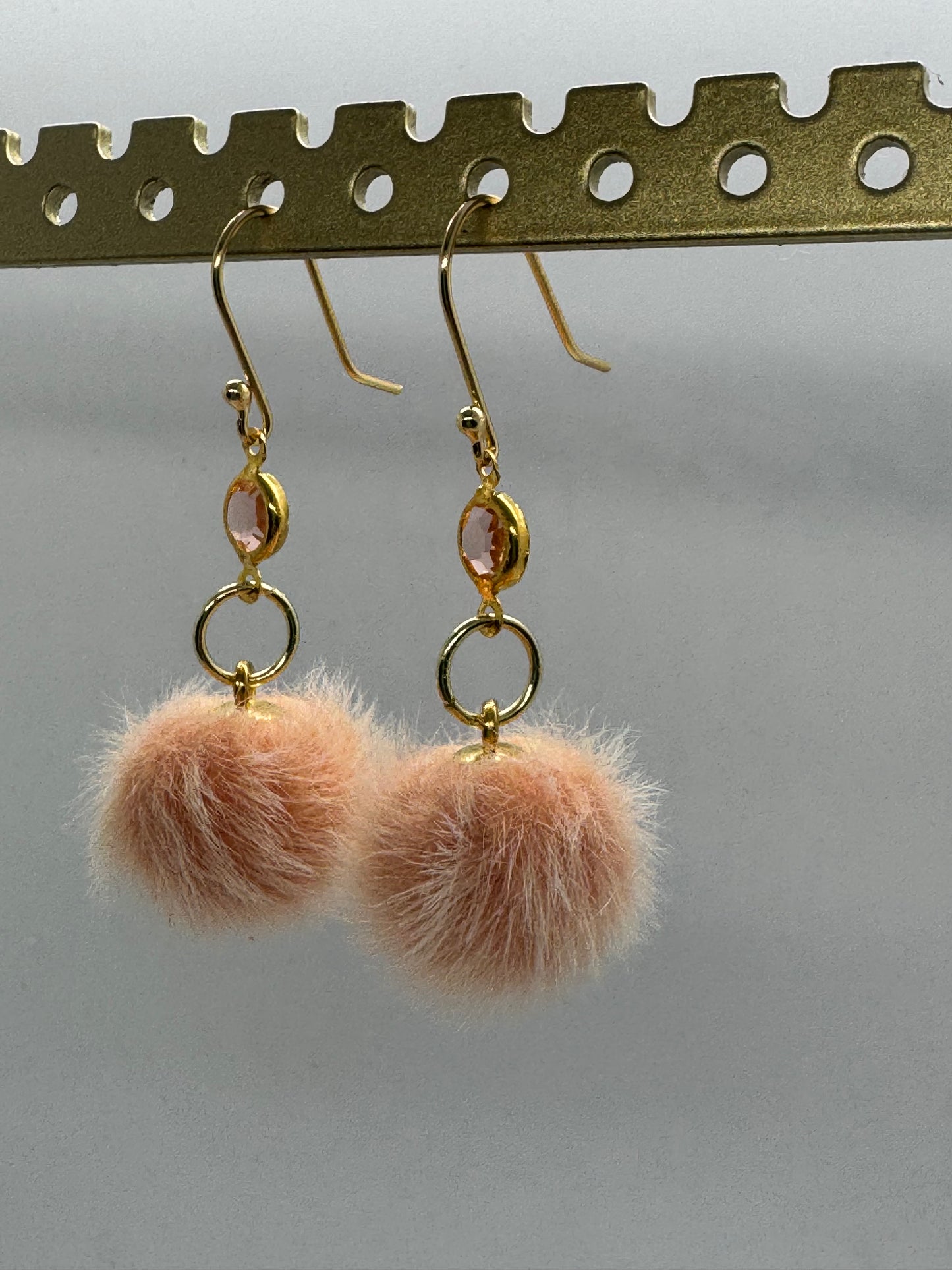 Peach pom pom dangle earrings