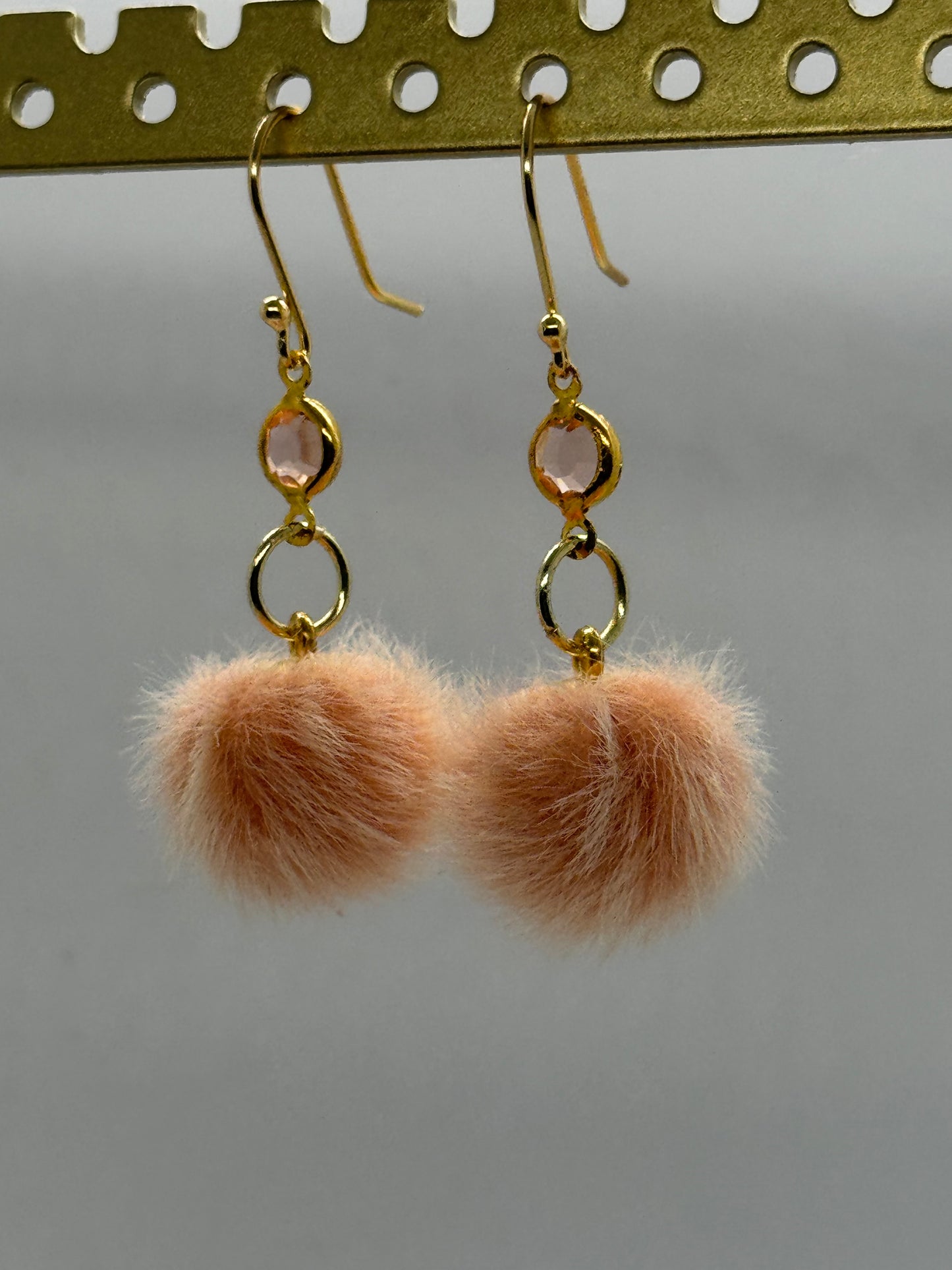 Peach pom pom dangle earrings