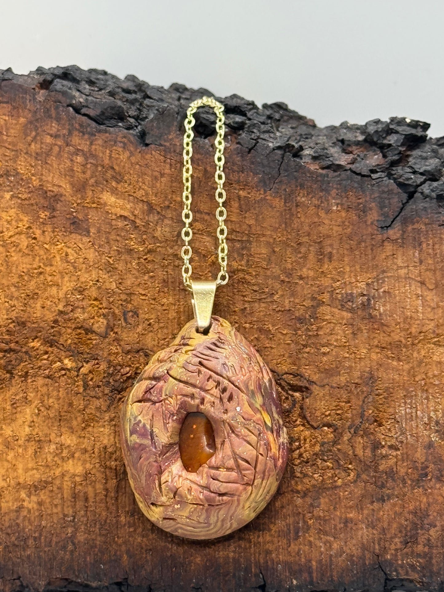 Amber and clay pendant necklace