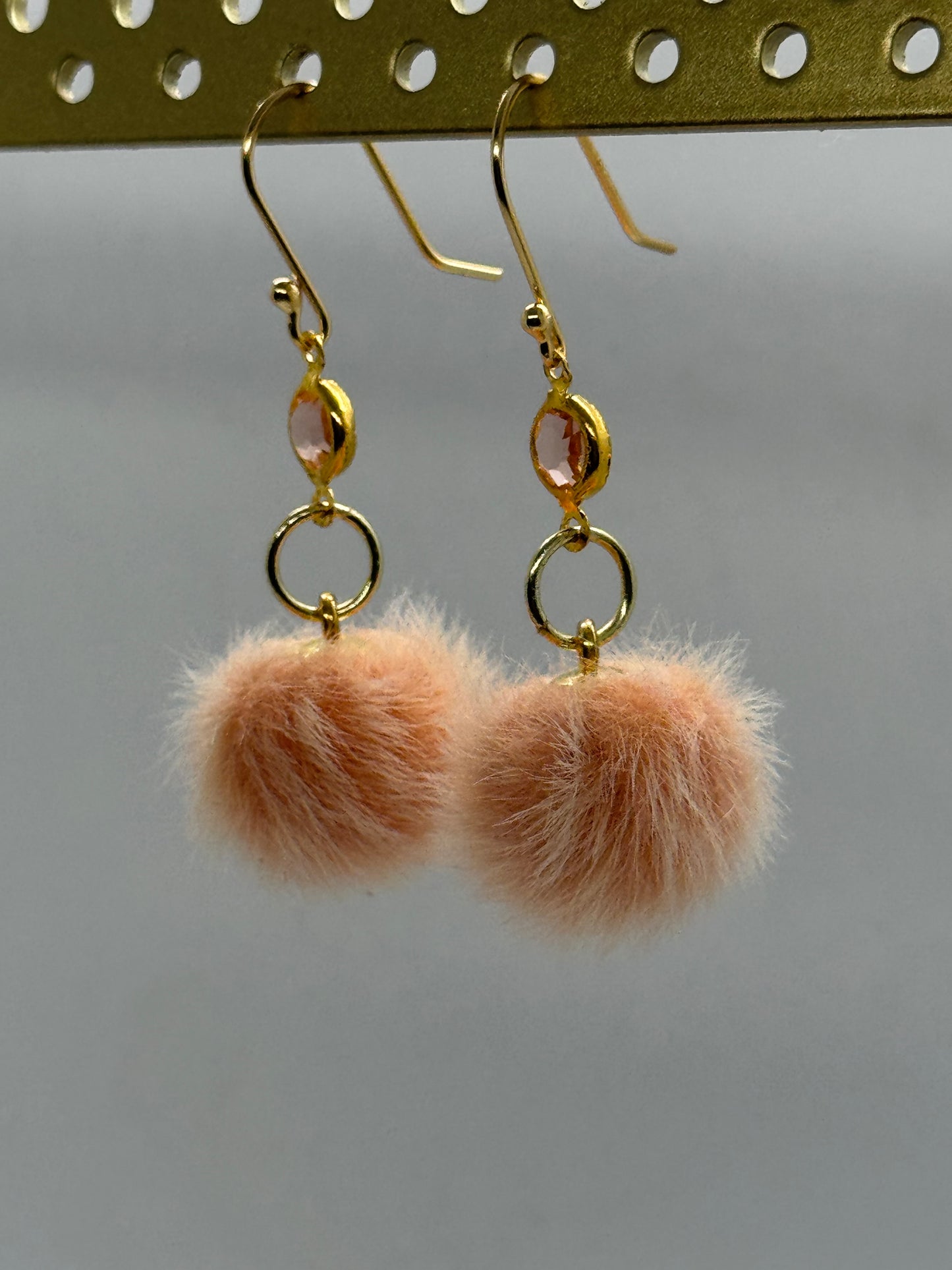 Peach pom pom dangle earrings