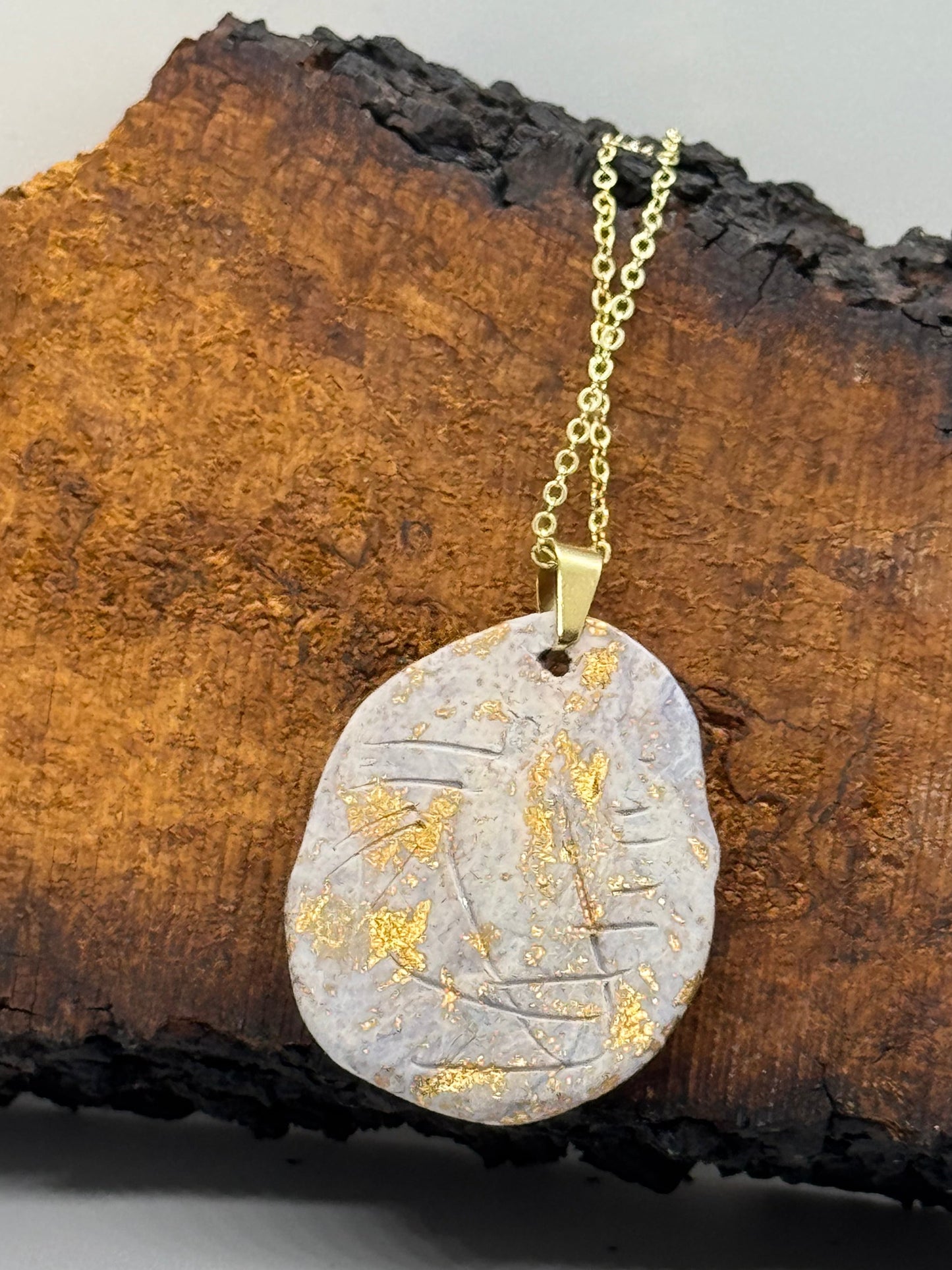 Double clear quartz necklace on gold chain