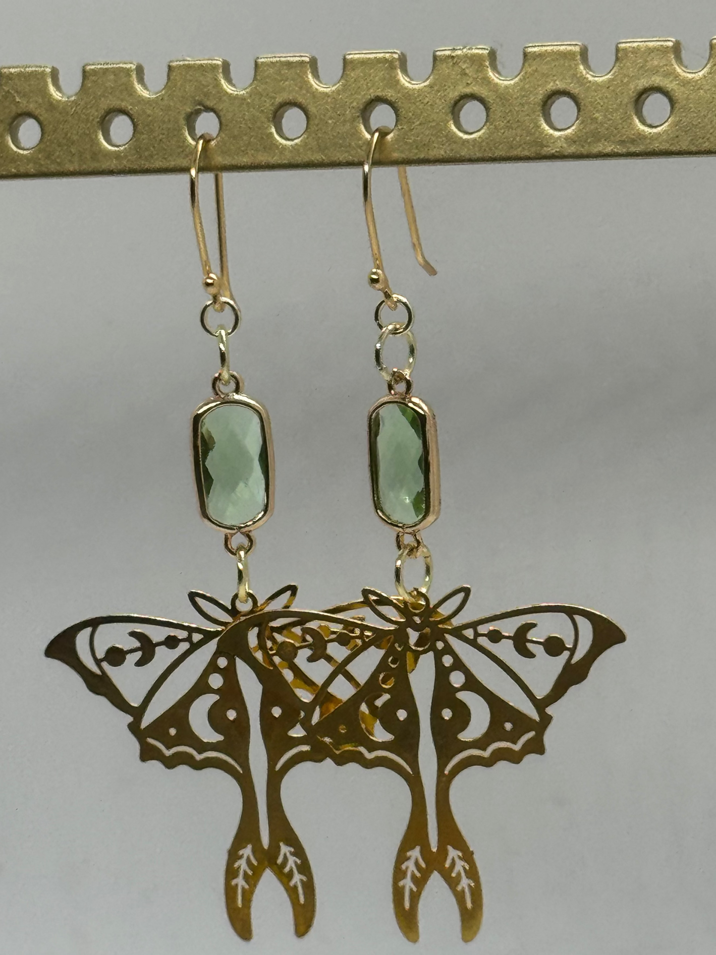 Gold moth and green glass earrings