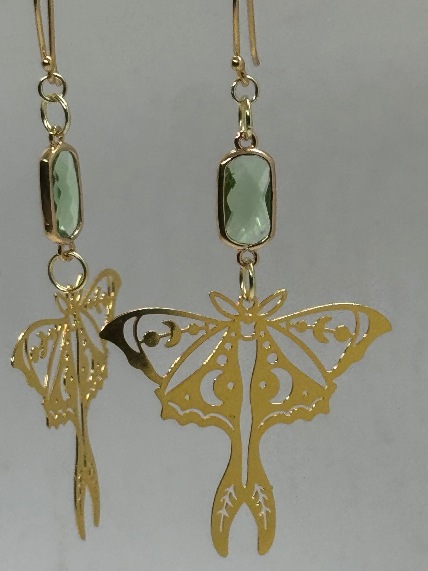Gold moth and green glass earrings