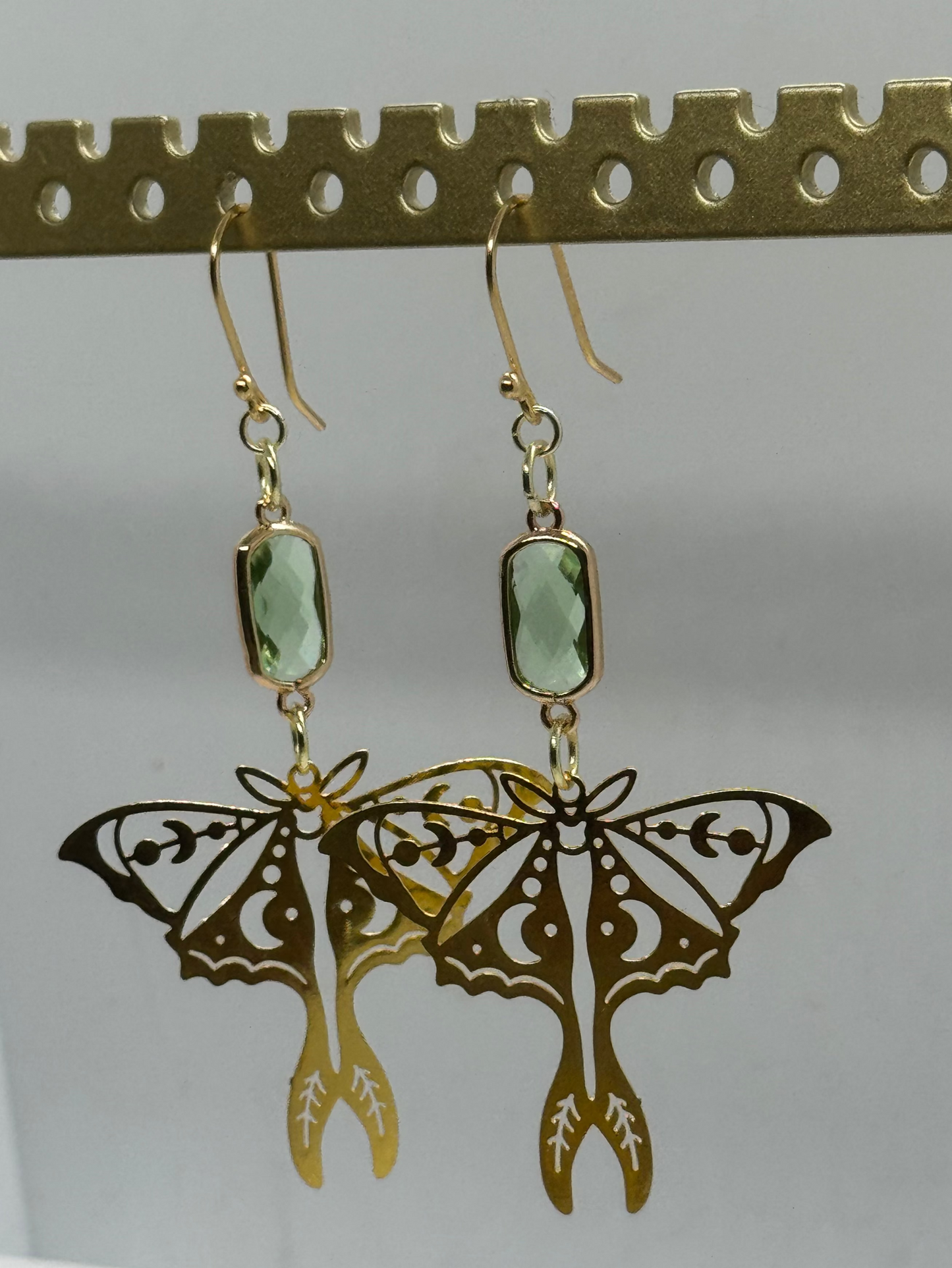 Gold moth and green glass earrings