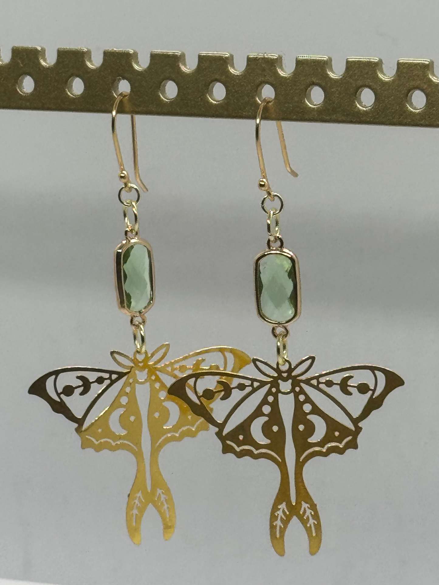 Gold moth and green glass earrings