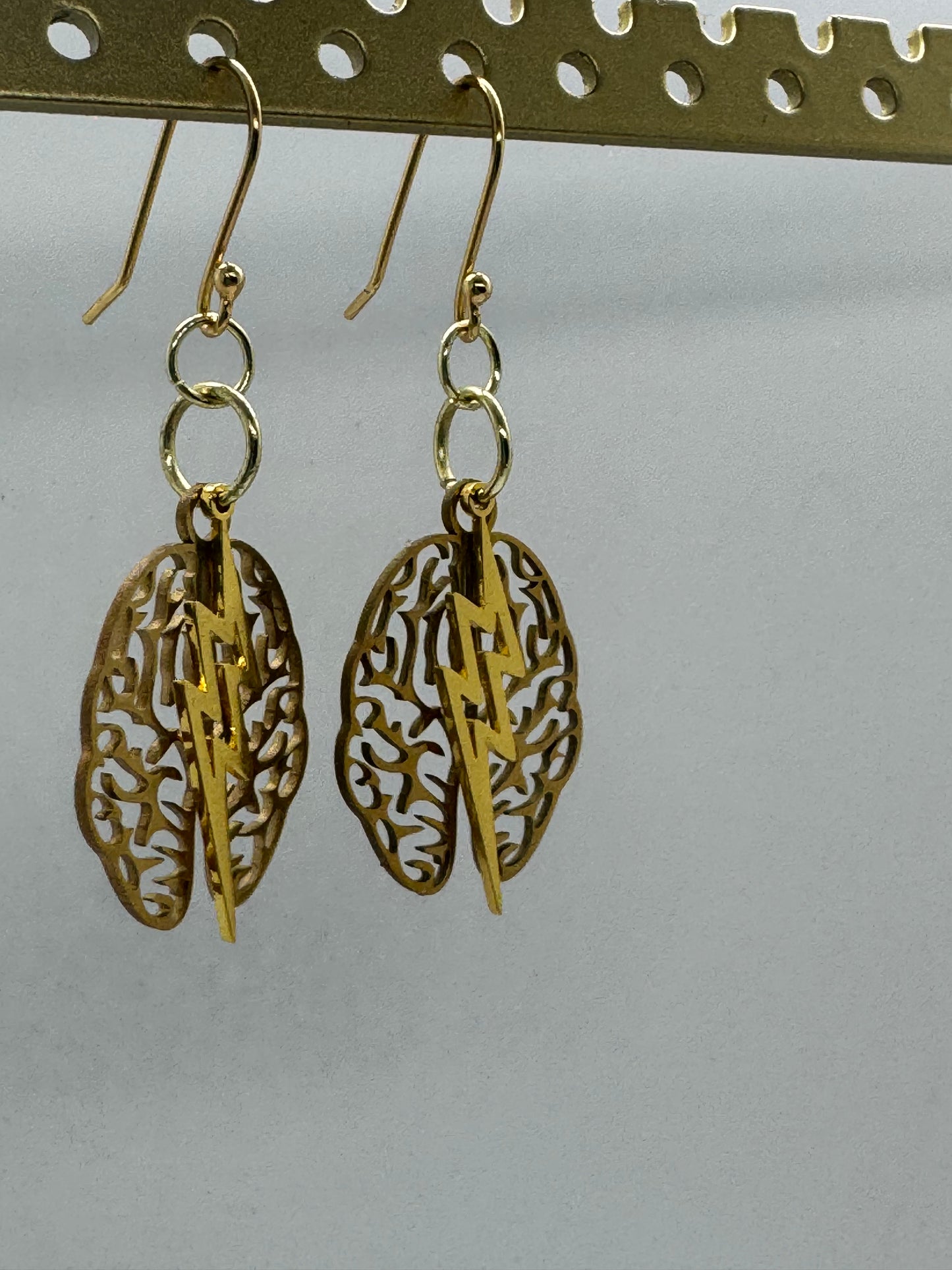 Brain and lightning gold earrings