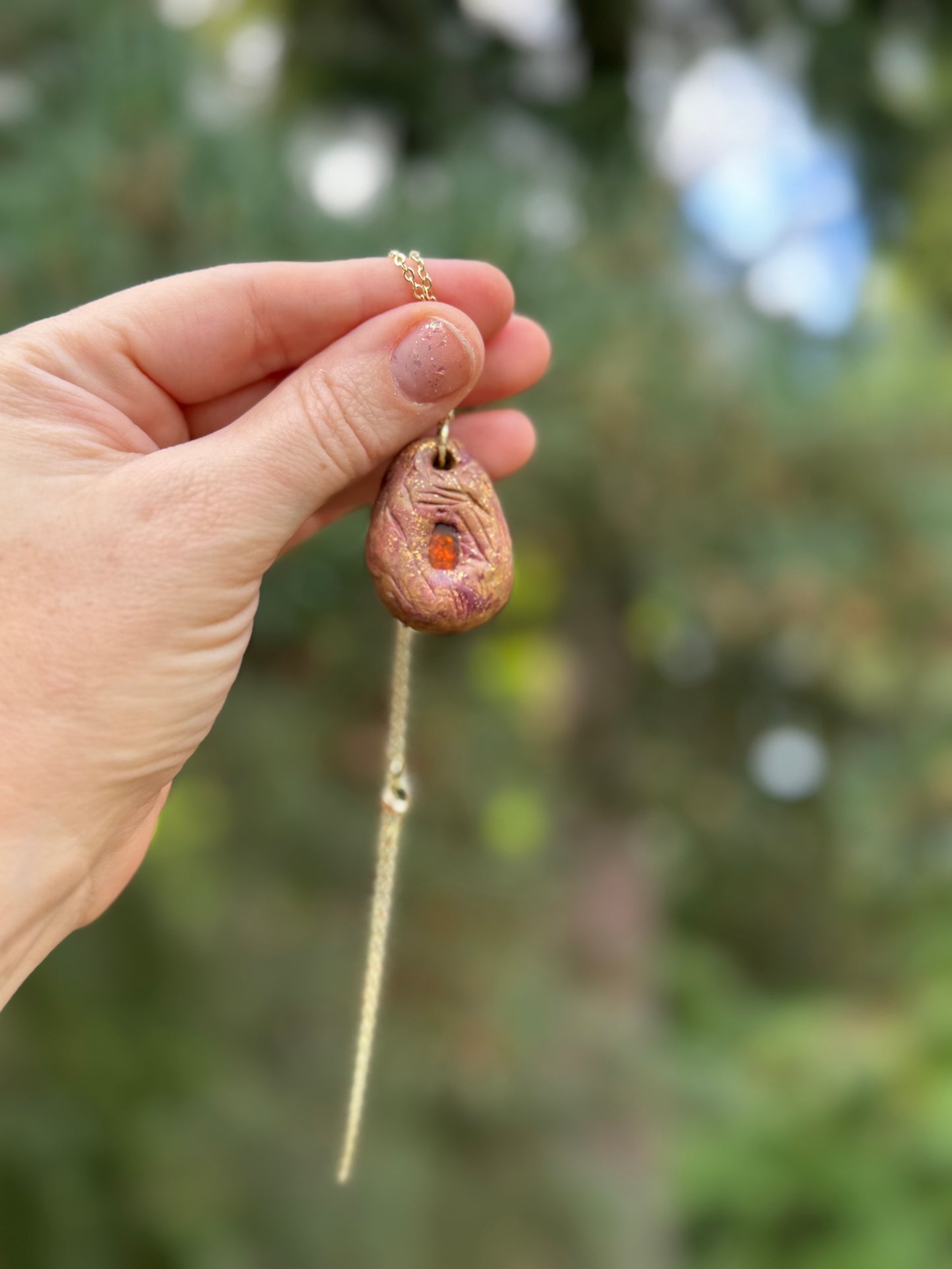 Amber and clay pendant necklace