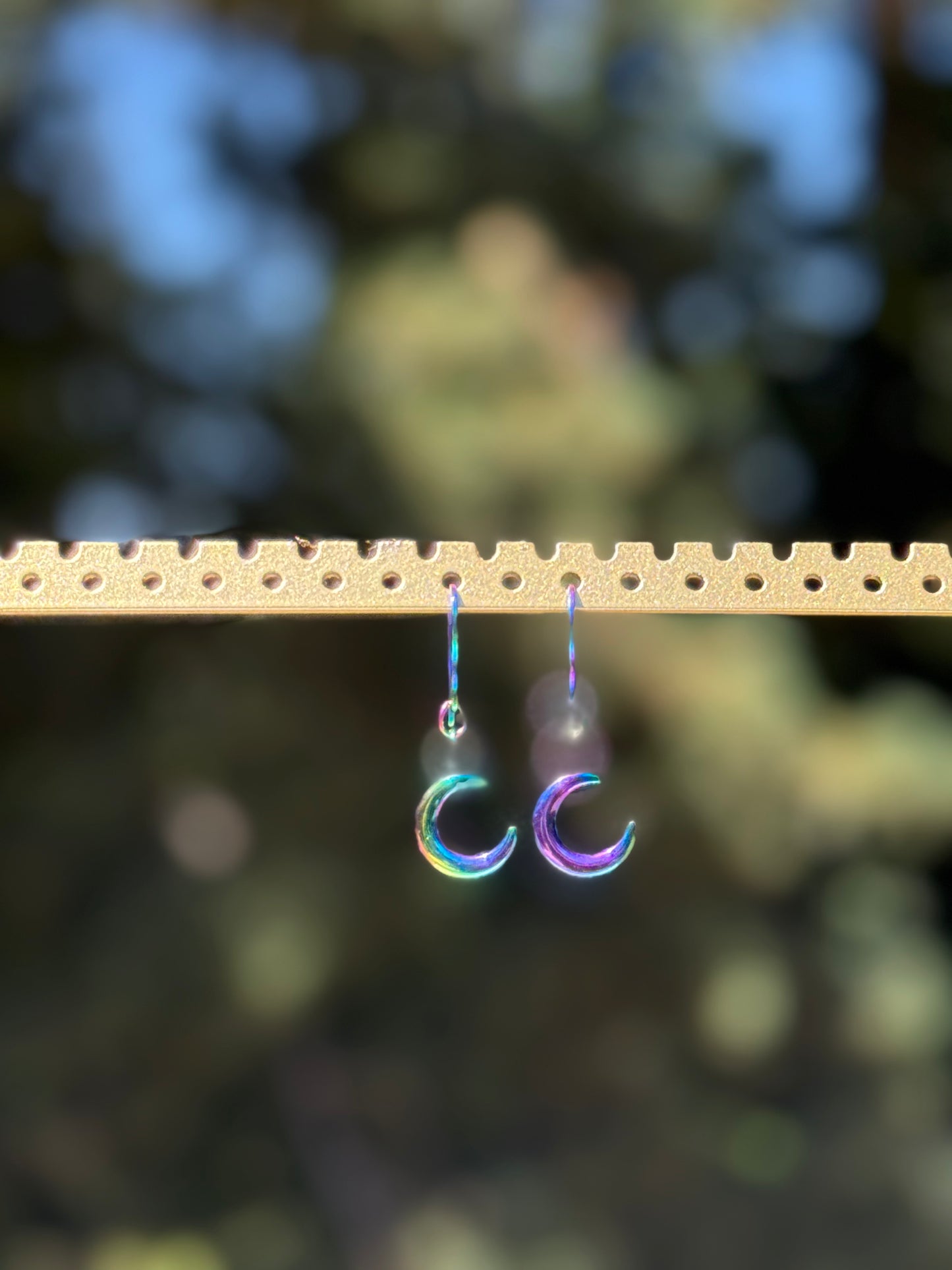 Iridescent purple crescent moon earrings