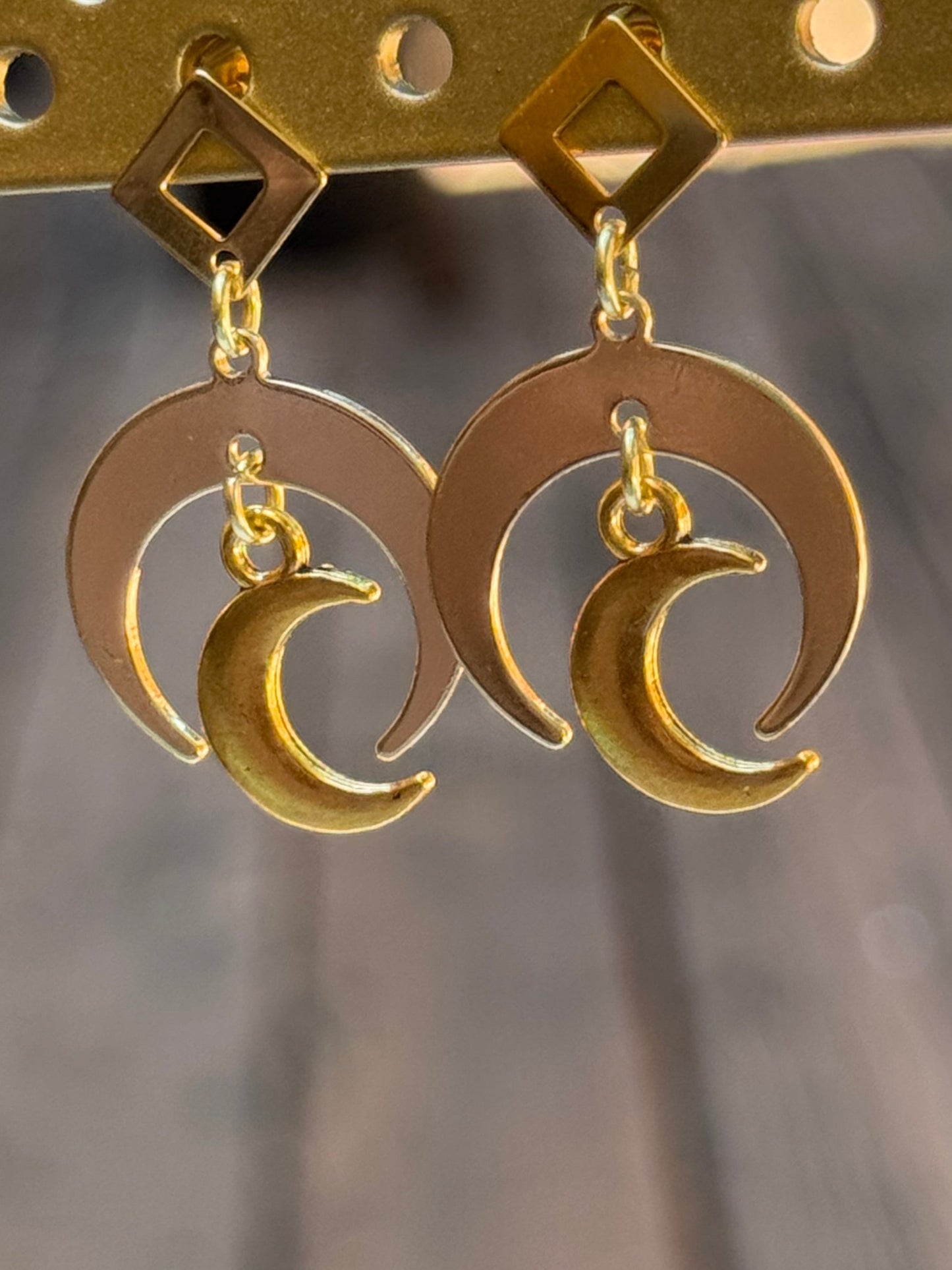 Gold crescent moon stud earrings