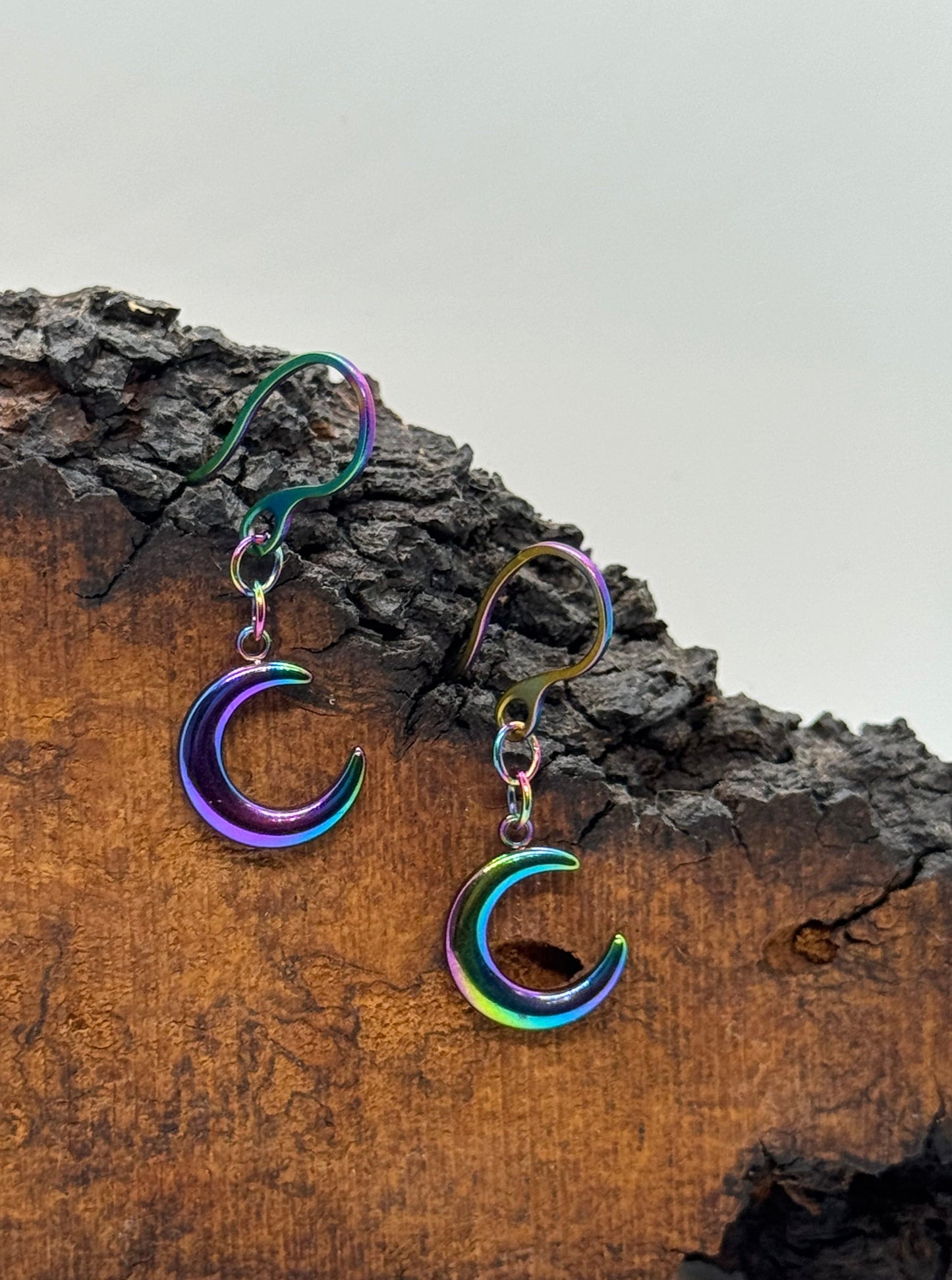 Iridescent purple crescent moon earrings