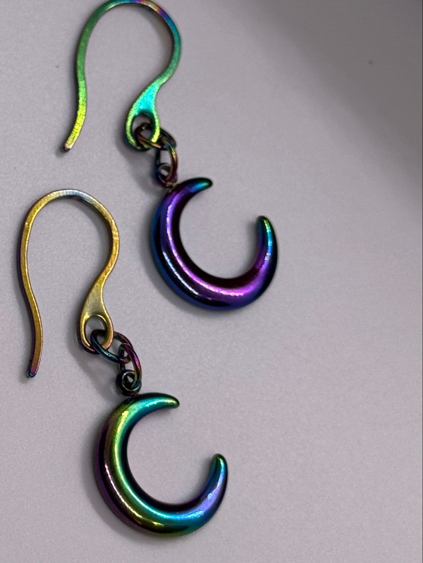 Iridescent purple crescent moon earrings