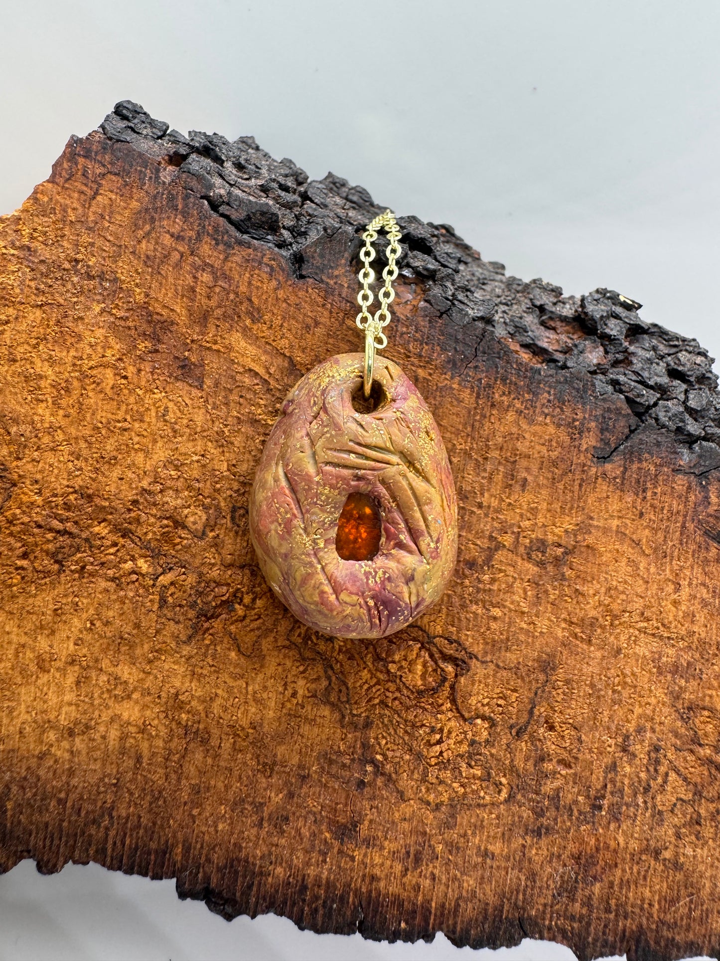 Amber and clay pendant necklace
