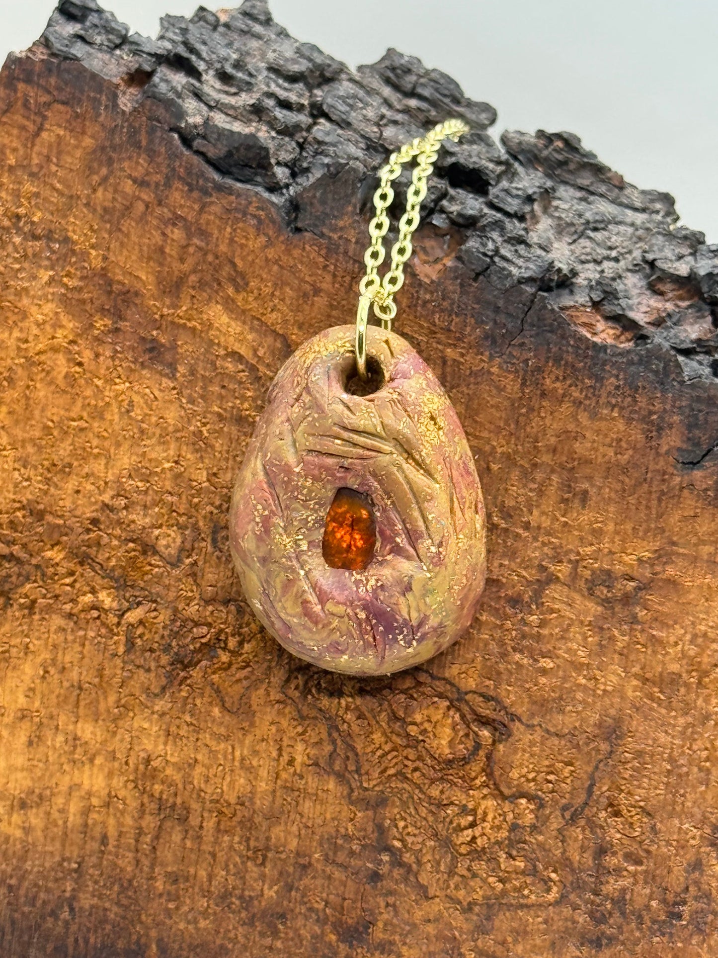 Amber and clay pendant necklace