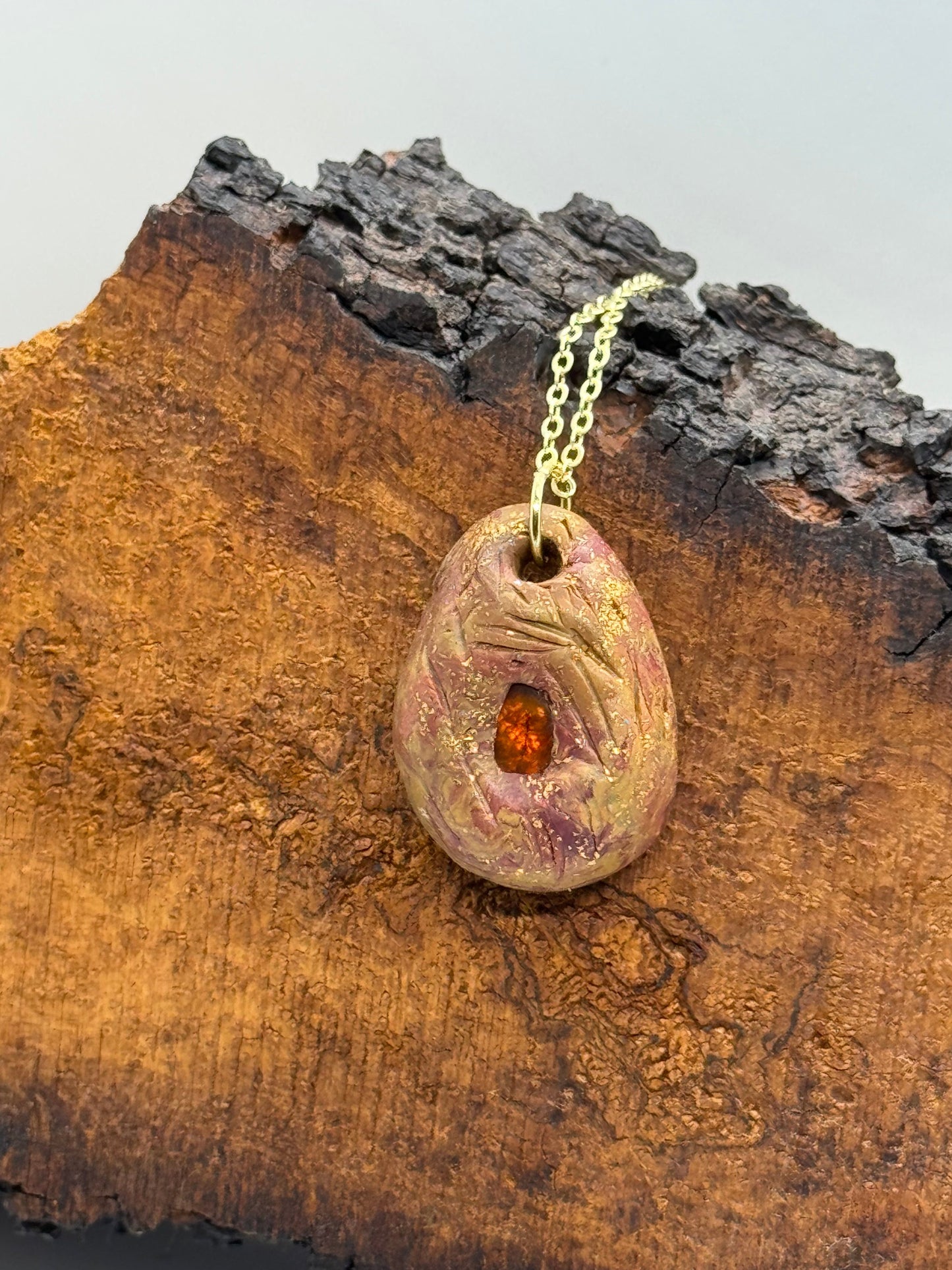 Amber and clay pendant necklace