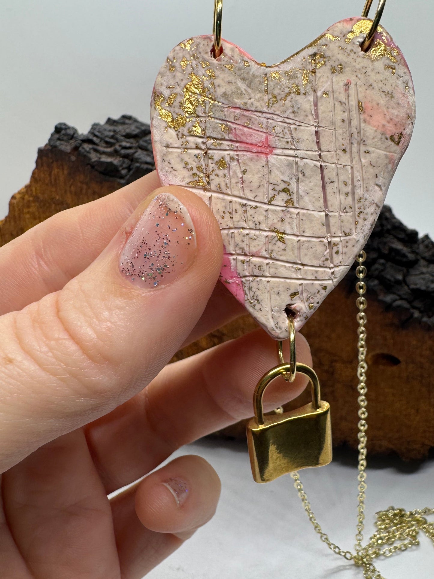 Heart-shaped necklace featuring pyrite, gold chain