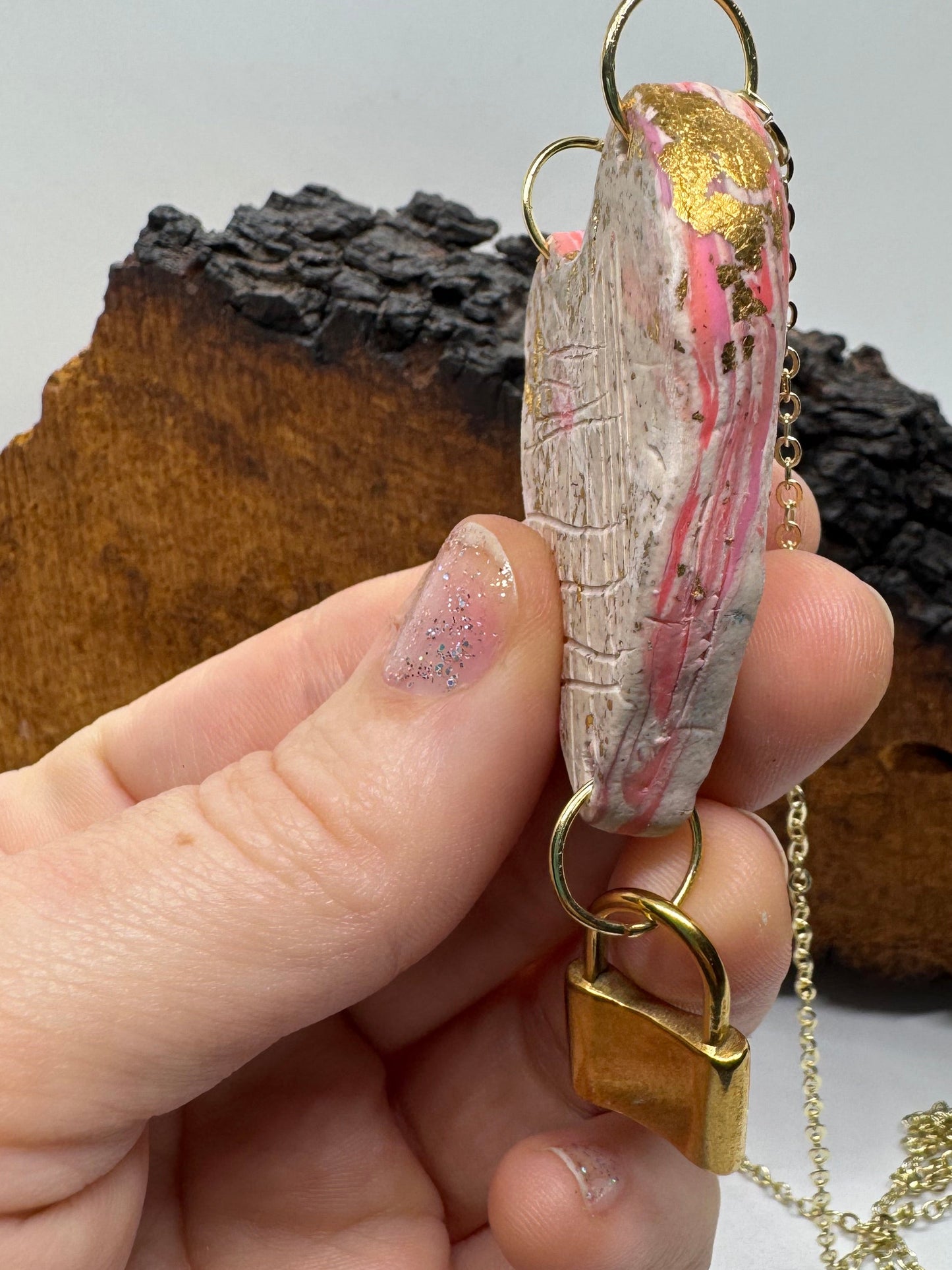 Heart-shaped necklace featuring pyrite, gold chain