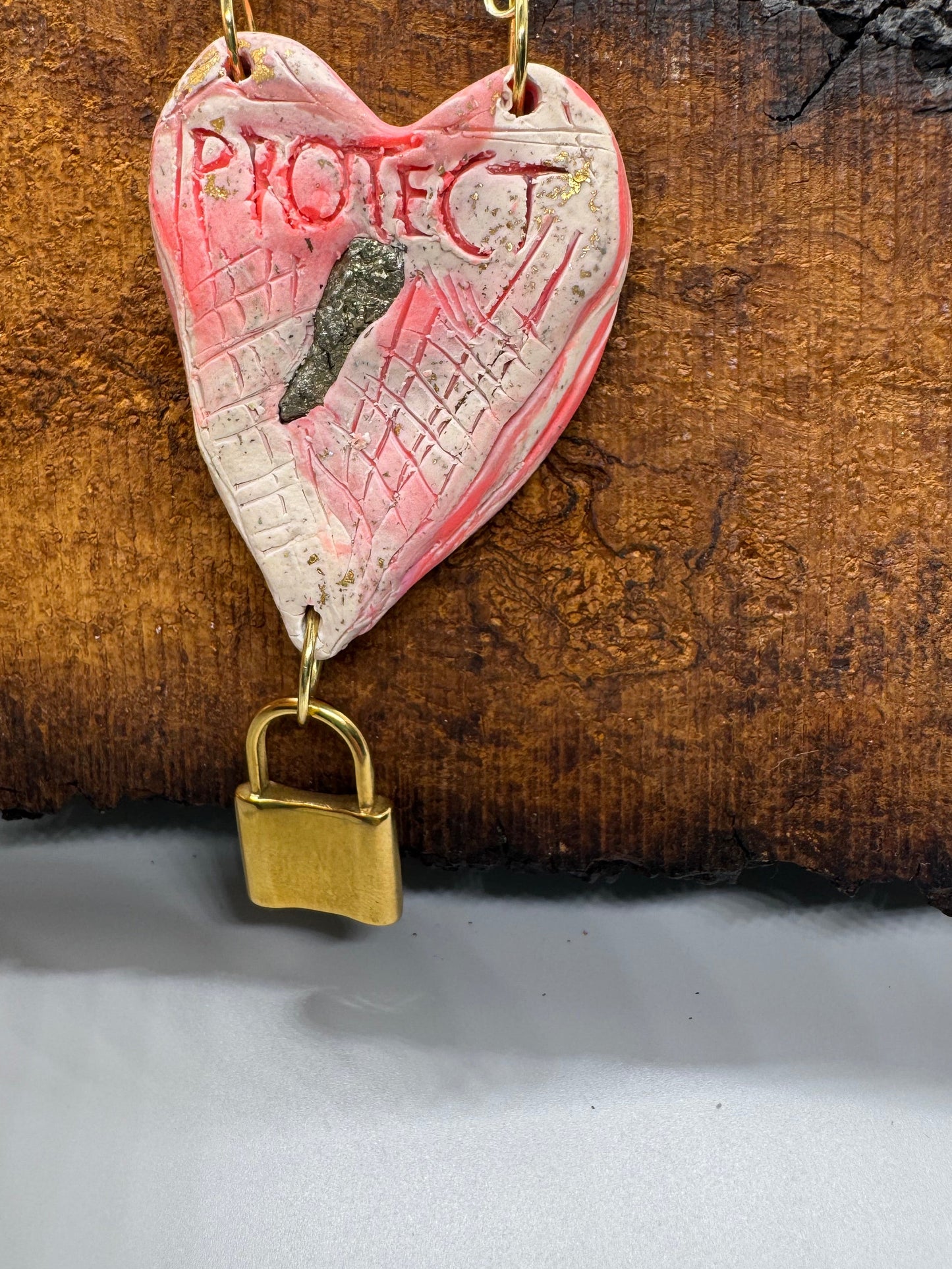 Heart-shaped necklace featuring pyrite, gold chain