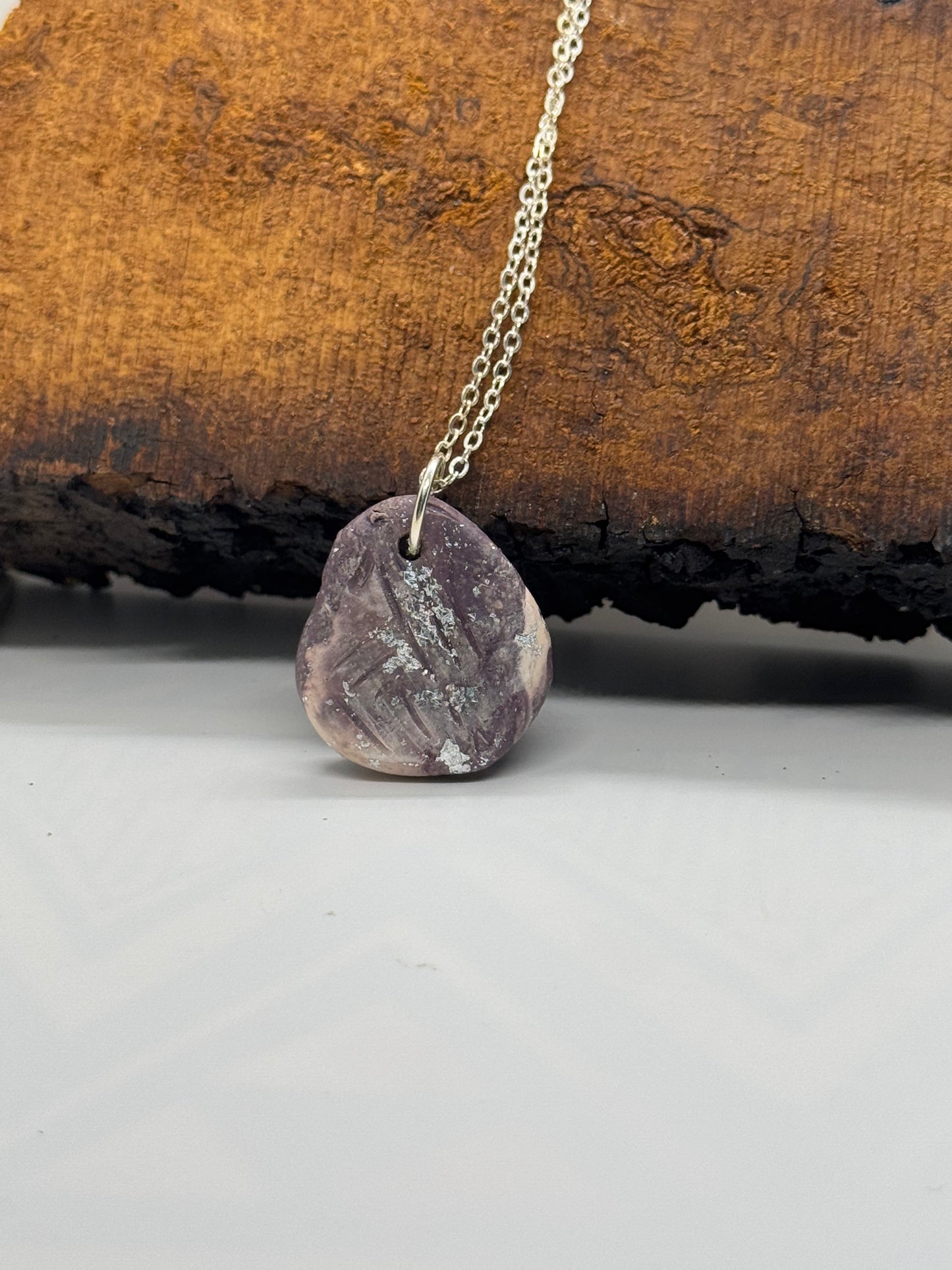 Kunzite and clay necklace on silver chain