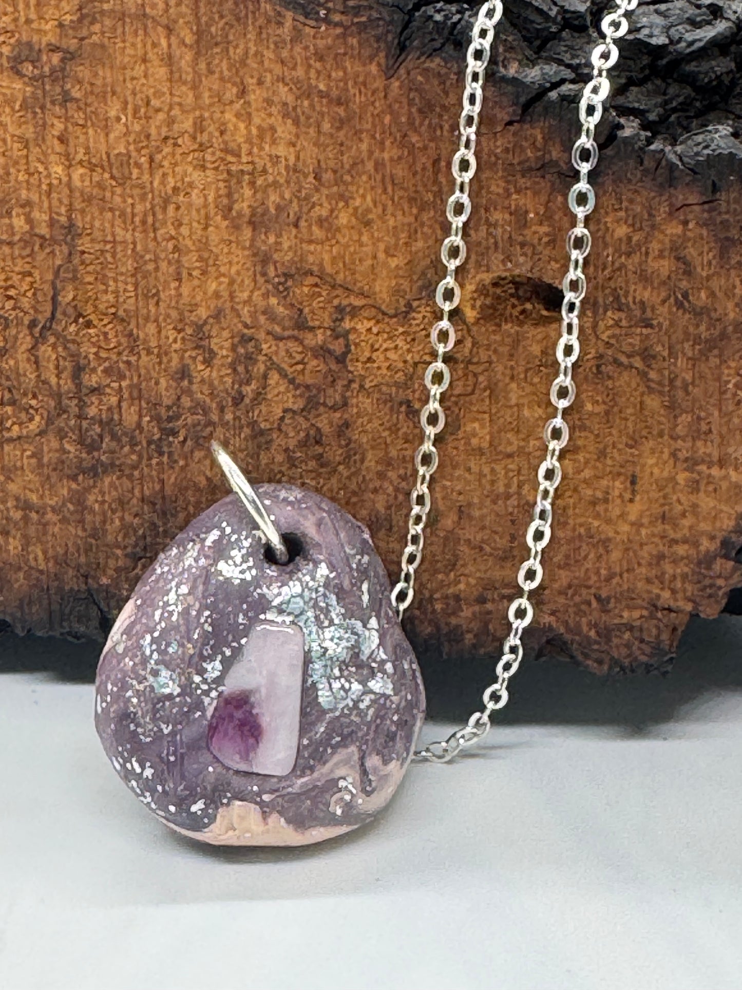 Kunzite and clay necklace on silver chain