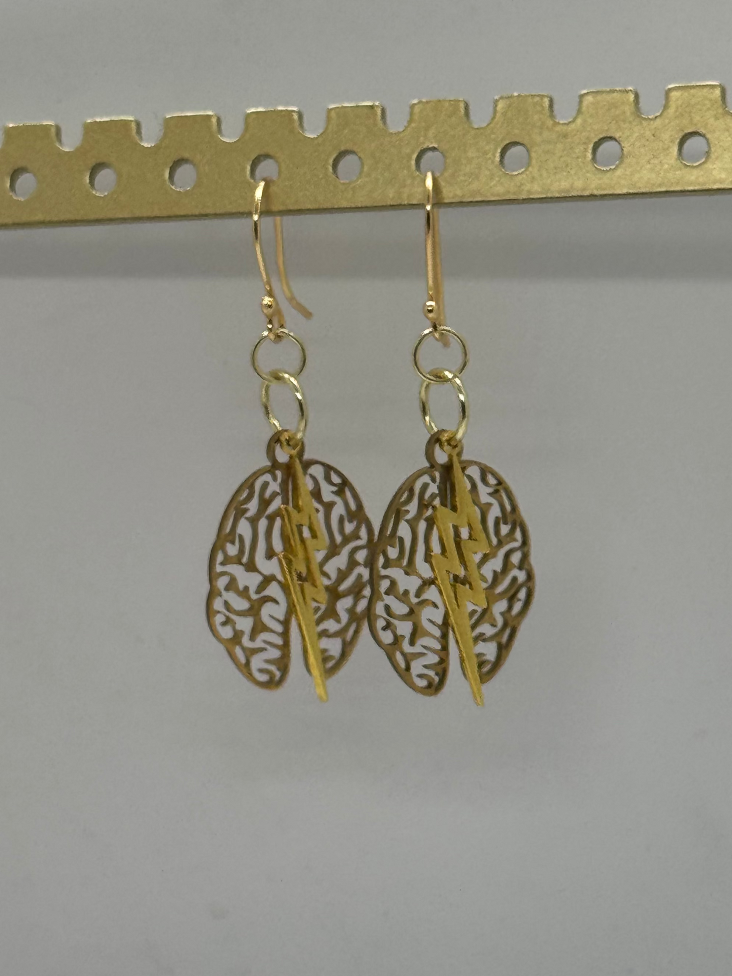 Brain and lightning gold earrings