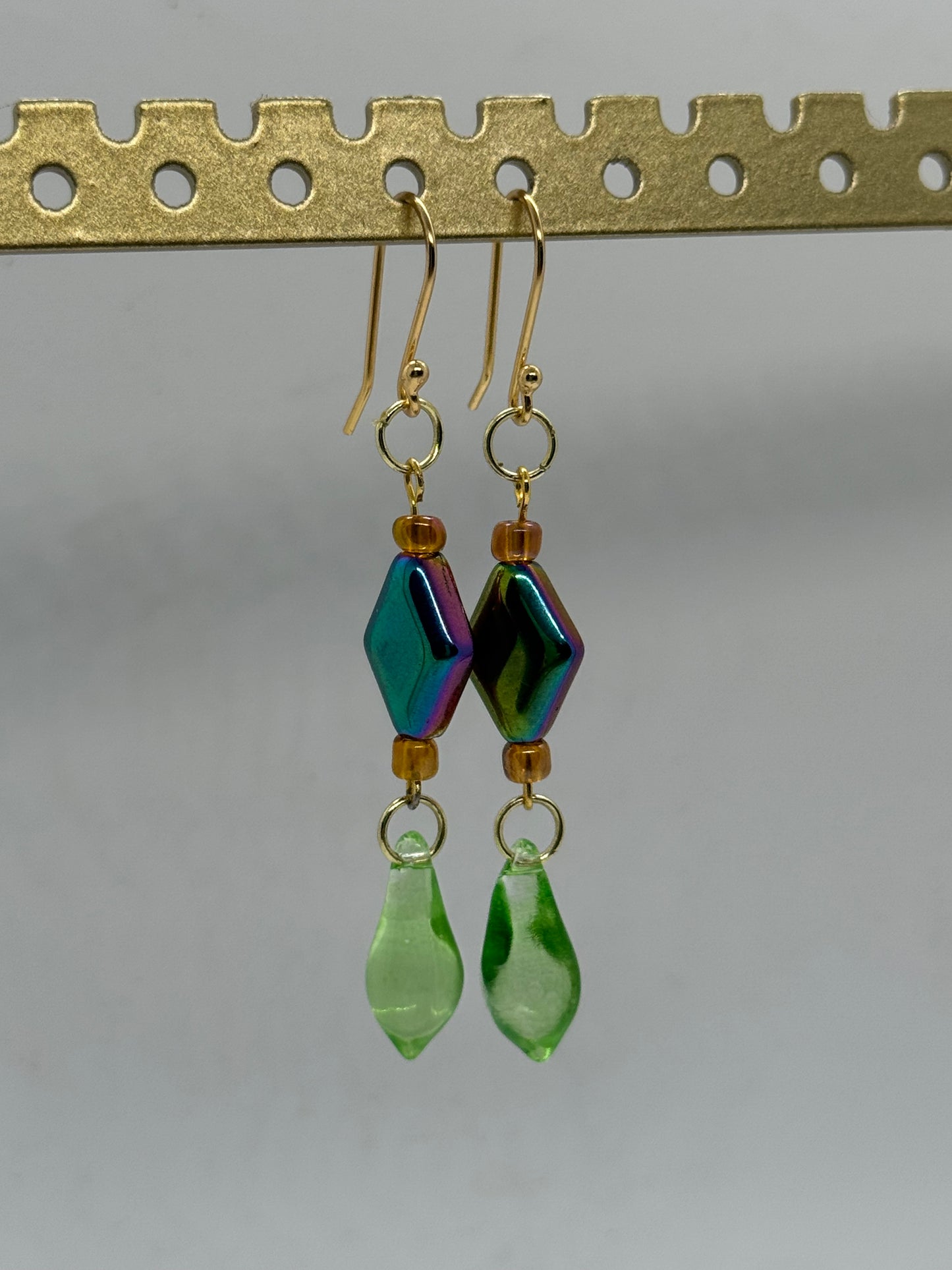 Green glass oil spill earrings