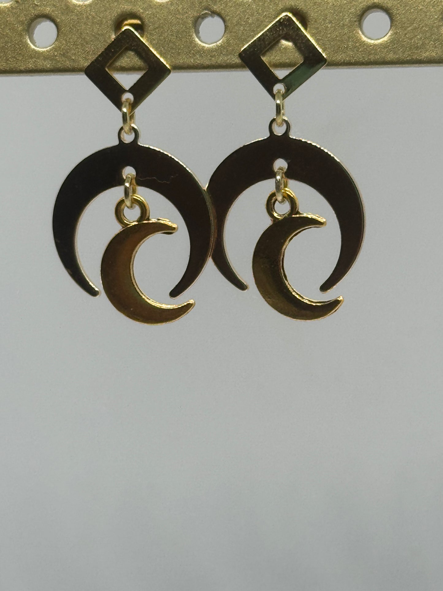 Gold crescent moon stud earrings